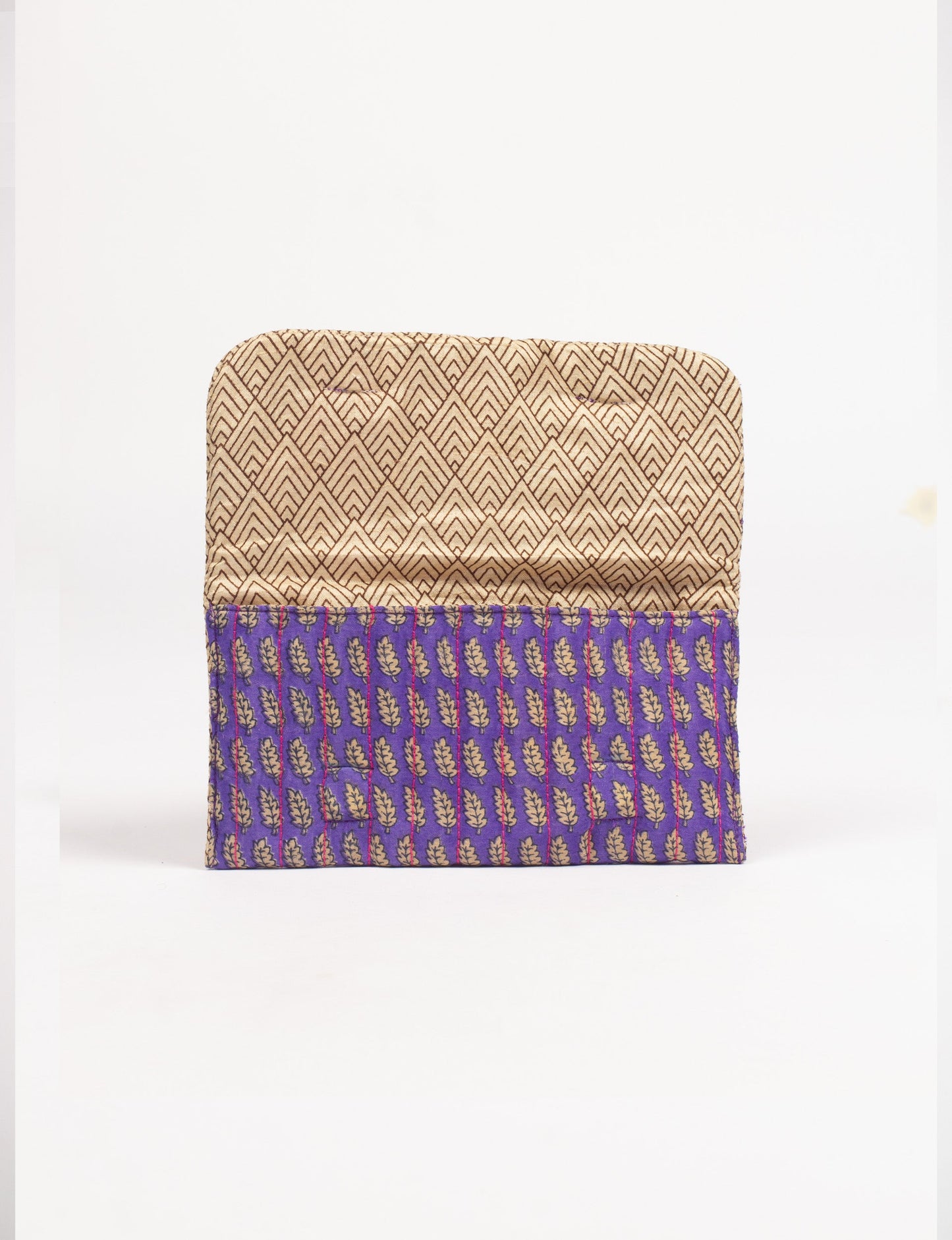 Quilted sunglasses case made from recycled sari products, featuring a secure magnetic closure. A chic example of ethical fashion, conscious clothing, and carbon neutral fashion. Protect your sunglasses while embracing circular fashion and upcycled garments.