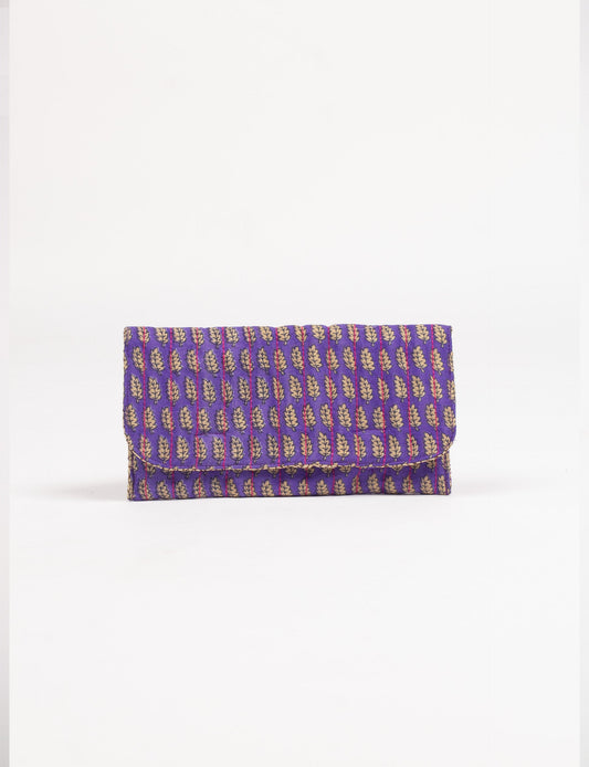 Quilted sunglasses case made from recycled sari products, featuring a secure magnetic closure. A chic example of ethical fashion, conscious clothing, and carbon neutral fashion. Protect your sunglasses while embracing circular fashion and upcycled garments.