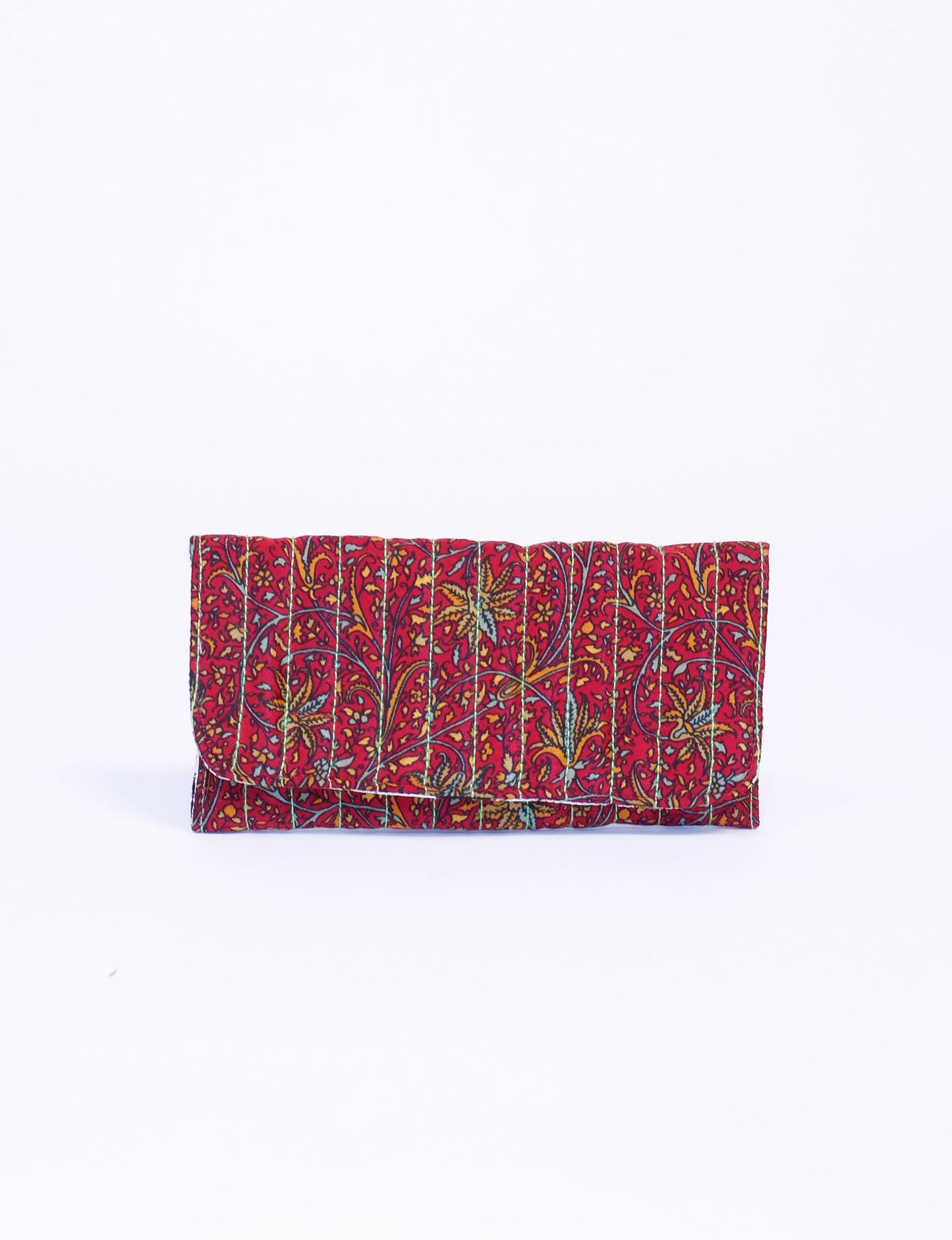 Quilted sunglasses case made from recycled sari products, featuring a secure magnetic closure. A chic example of ethical fashion, conscious clothing, and carbon neutral fashion. Protect your sunglasses while embracing circular fashion and upcycled garments.