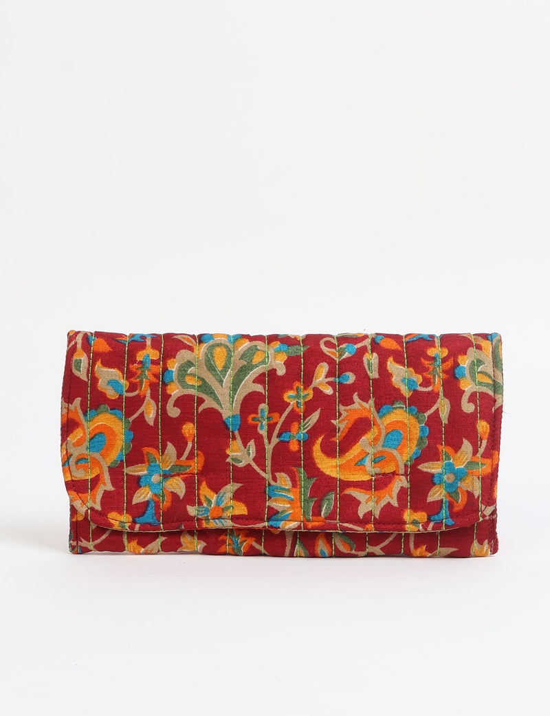 Quilted sunglasses case made from recycled sari products, featuring a secure magnetic closure. A chic example of ethical fashion, conscious clothing, and carbon neutral fashion. Protect your sunglasses while embracing circular fashion and upcycled garments.