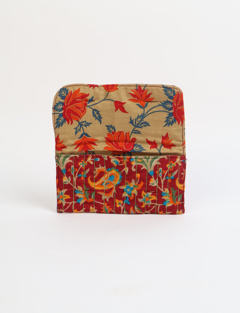 Quilted sunglasses case made from recycled sari products, featuring a secure magnetic closure. A chic example of ethical fashion, conscious clothing, and carbon neutral fashion. Protect your sunglasses while embracing circular fashion and upcycled garments.