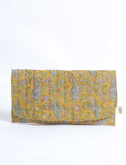 Quilted sunglasses case made from recycled sari products, featuring a secure magnetic closure. A chic example of ethical fashion, conscious clothing, and carbon neutral fashion. Protect your sunglasses while embracing circular fashion and upcycled garments.