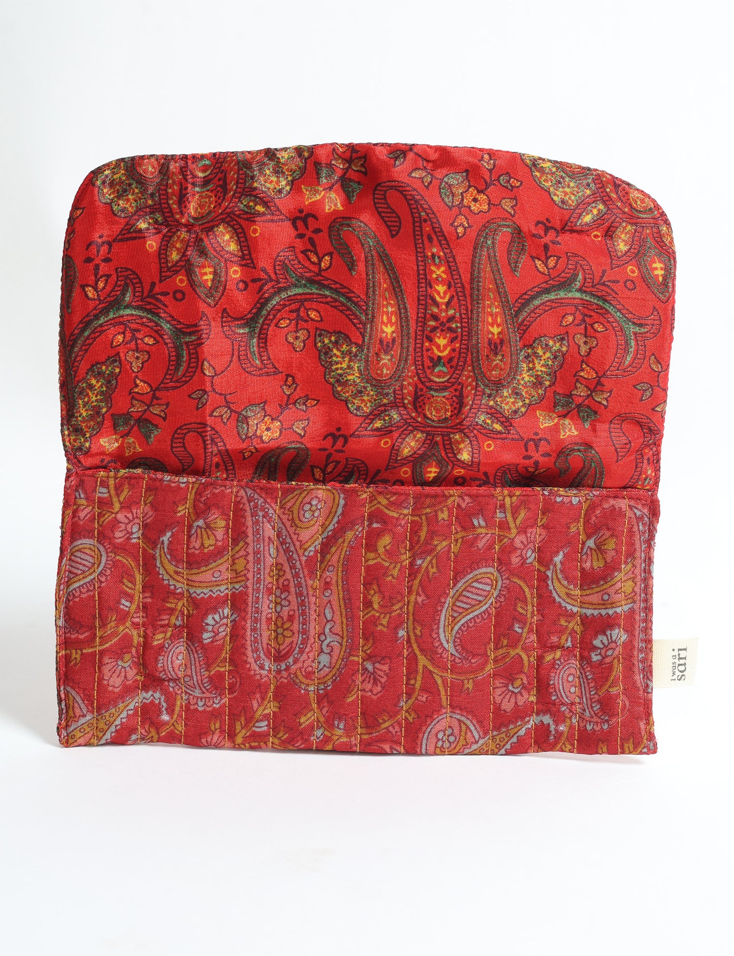 Quilted sunglasses case made from recycled sari products, featuring a secure magnetic closure. A chic example of ethical fashion, conscious clothing, and carbon neutral fashion. Protect your sunglasses while embracing circular fashion and upcycled garments.