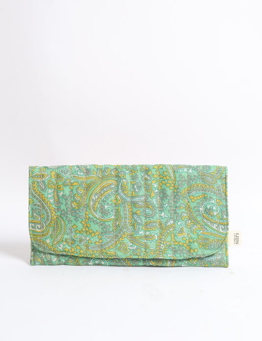 Quilted sunglasses case made from recycled sari products, featuring a secure magnetic closure. A chic example of ethical fashion, conscious clothing, and carbon neutral fashion. Protect your sunglasses while embracing circular fashion and upcycled garments.