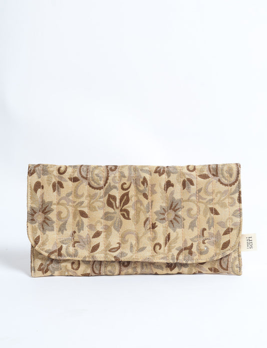Quilted sunglasses case made from recycled sari products, featuring a secure magnetic closure. A chic example of ethical fashion, conscious clothing, and carbon neutral fashion. Protect your sunglasses while embracing circular fashion and upcycled garments.
