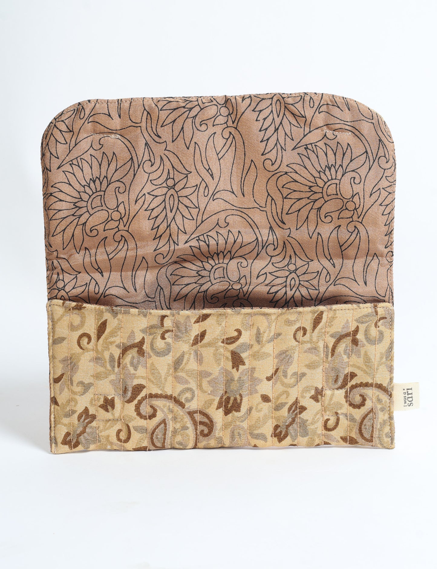 Quilted sunglasses case made from recycled sari products, featuring a secure magnetic closure. A chic example of ethical fashion, conscious clothing, and carbon neutral fashion. Protect your sunglasses while embracing circular fashion and upcycled garments.