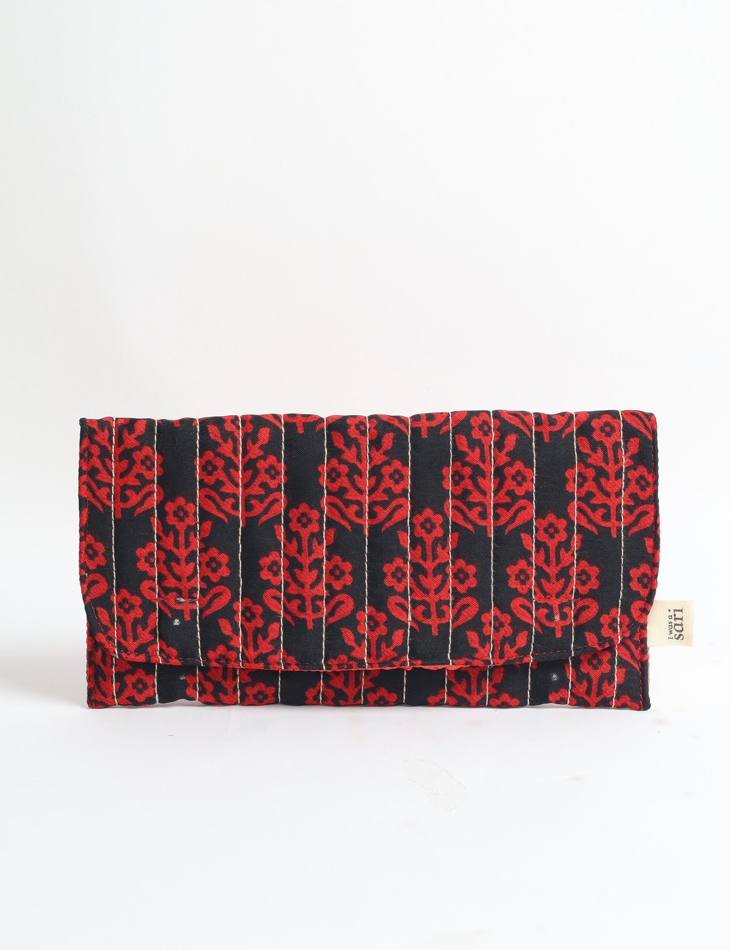 Quilted sunglasses case made from recycled sari products, featuring a secure magnetic closure. A chic example of ethical fashion, conscious clothing, and carbon neutral fashion. Protect your sunglasses while embracing circular fashion and upcycled garments.