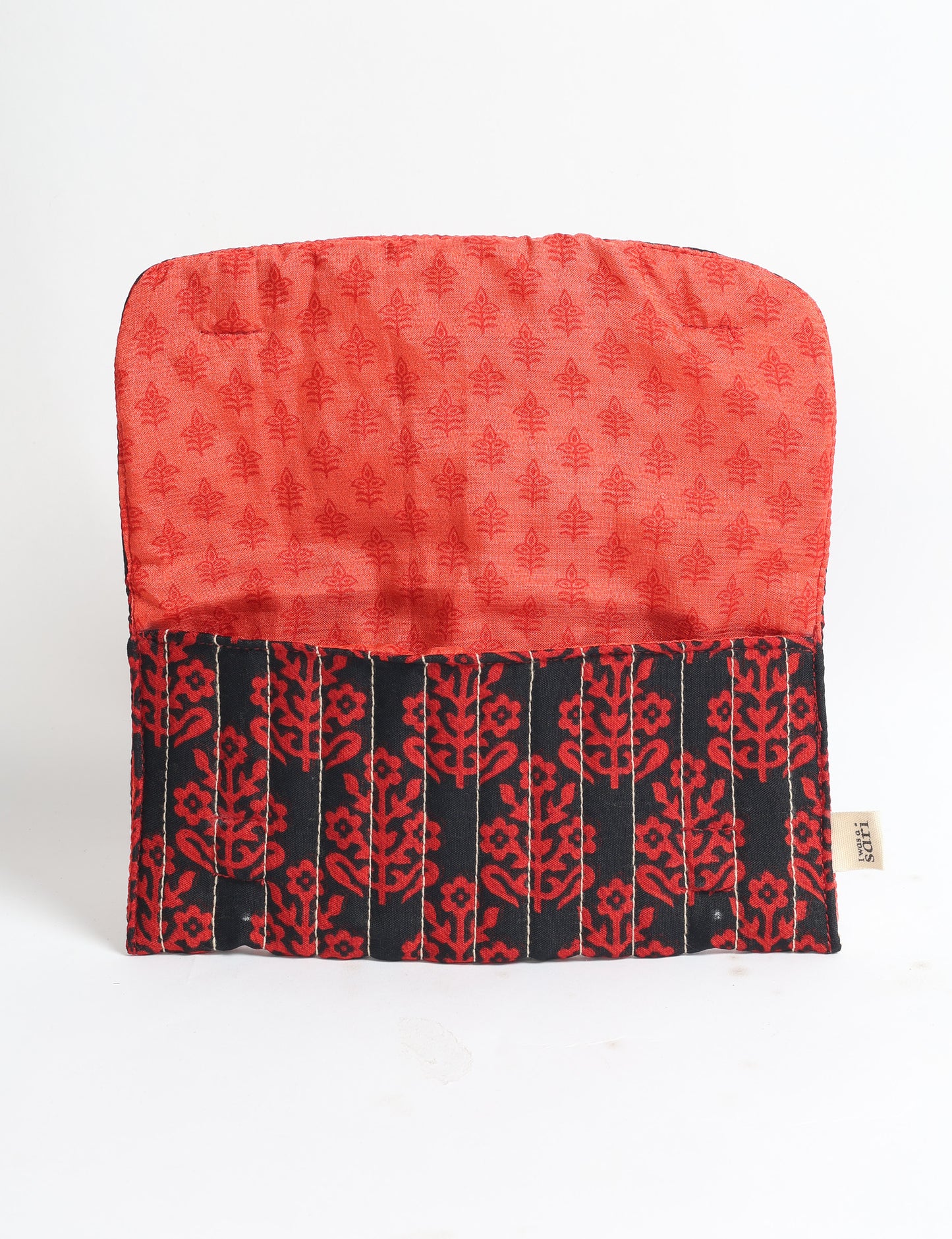 Quilted sunglasses case made from recycled sari products, featuring a secure magnetic closure. A chic example of ethical fashion, conscious clothing, and carbon neutral fashion. Protect your sunglasses while embracing circular fashion and upcycled garments.