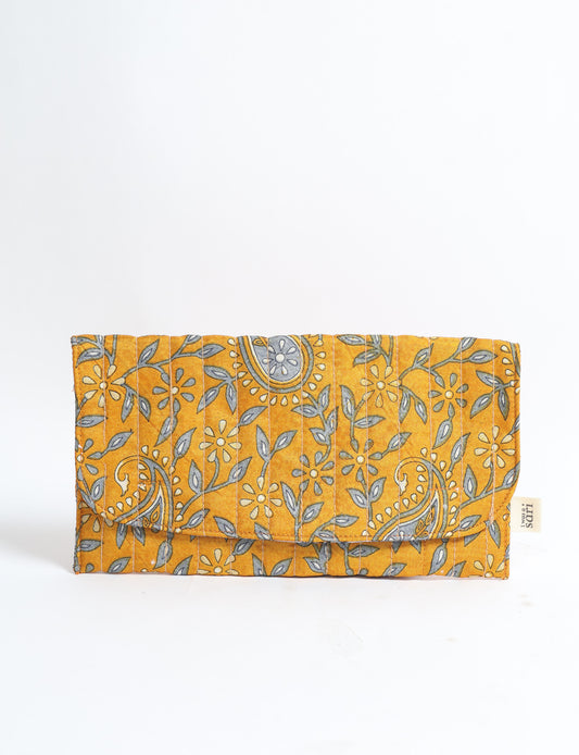 Quilted sunglasses case made from recycled sari products, featuring a secure magnetic closure. A chic example of ethical fashion, conscious clothing, and carbon neutral fashion. Protect your sunglasses while embracing circular fashion and upcycled garments.