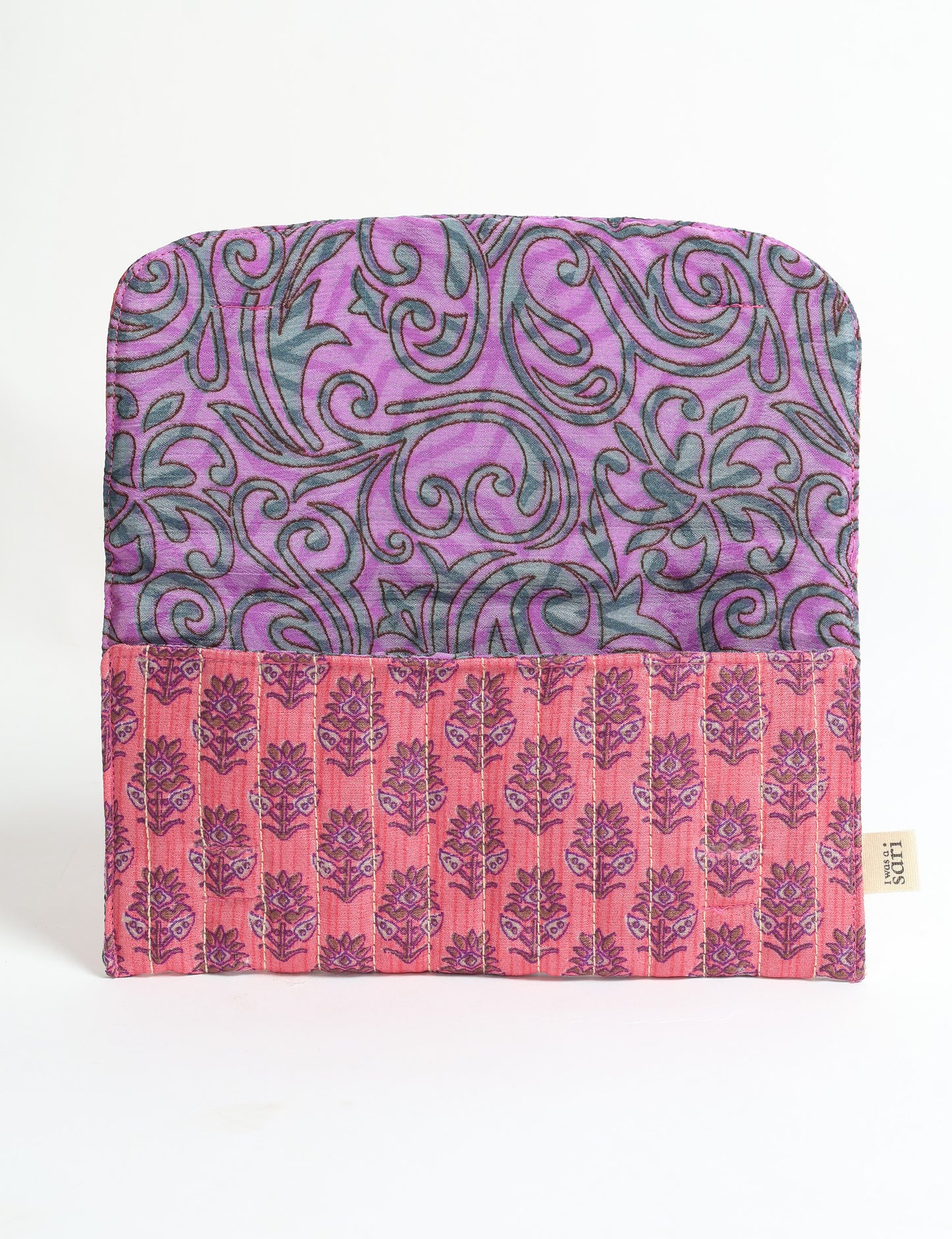 Quilted sunglasses case made from recycled sari products, featuring a secure magnetic closure. A chic example of ethical fashion, conscious clothing, and carbon neutral fashion. Protect your sunglasses while embracing circular fashion and upcycled garments.