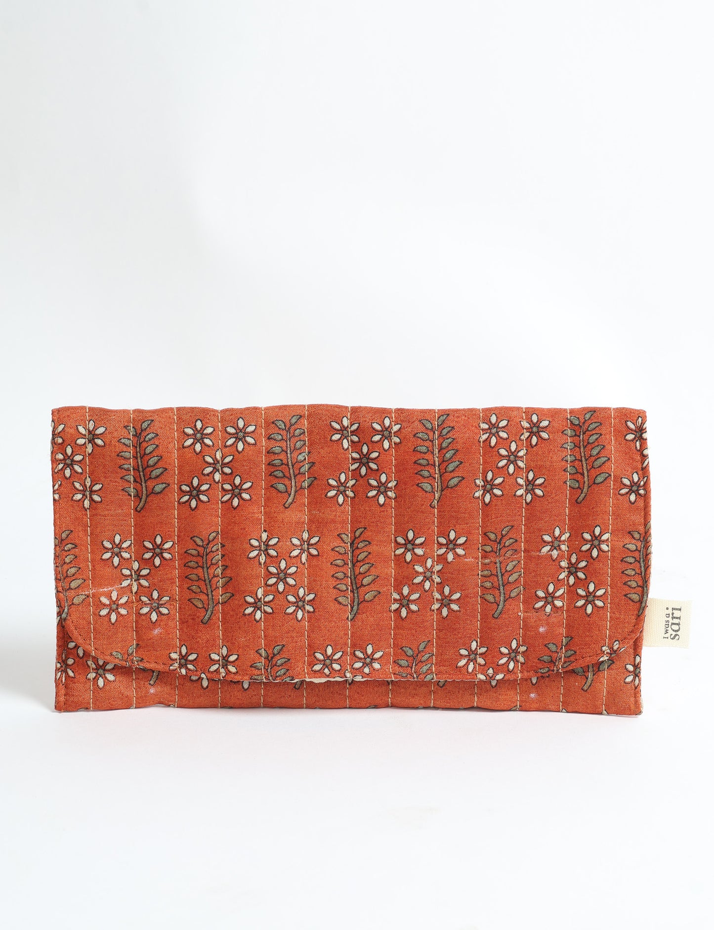 Quilted sunglasses case made from recycled sari products, featuring a secure magnetic closure. A chic example of ethical fashion, conscious clothing, and carbon neutral fashion. Protect your sunglasses while embracing circular fashion and upcycled garments.