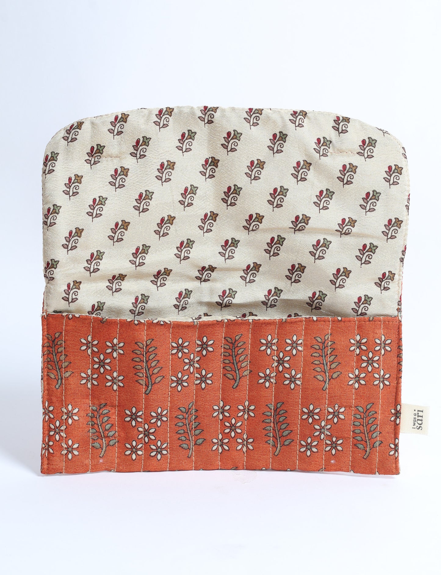 Quilted sunglasses case made from recycled sari products, featuring a secure magnetic closure. A chic example of ethical fashion, conscious clothing, and carbon neutral fashion. Protect your sunglasses while embracing circular fashion and upcycled garments.