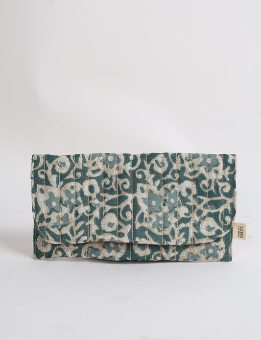 Quilted sunglasses case made from recycled sari products, featuring a secure magnetic closure. A chic example of ethical fashion, conscious clothing, and carbon neutral fashion. Protect your sunglasses while embracing circular fashion and upcycled garments.