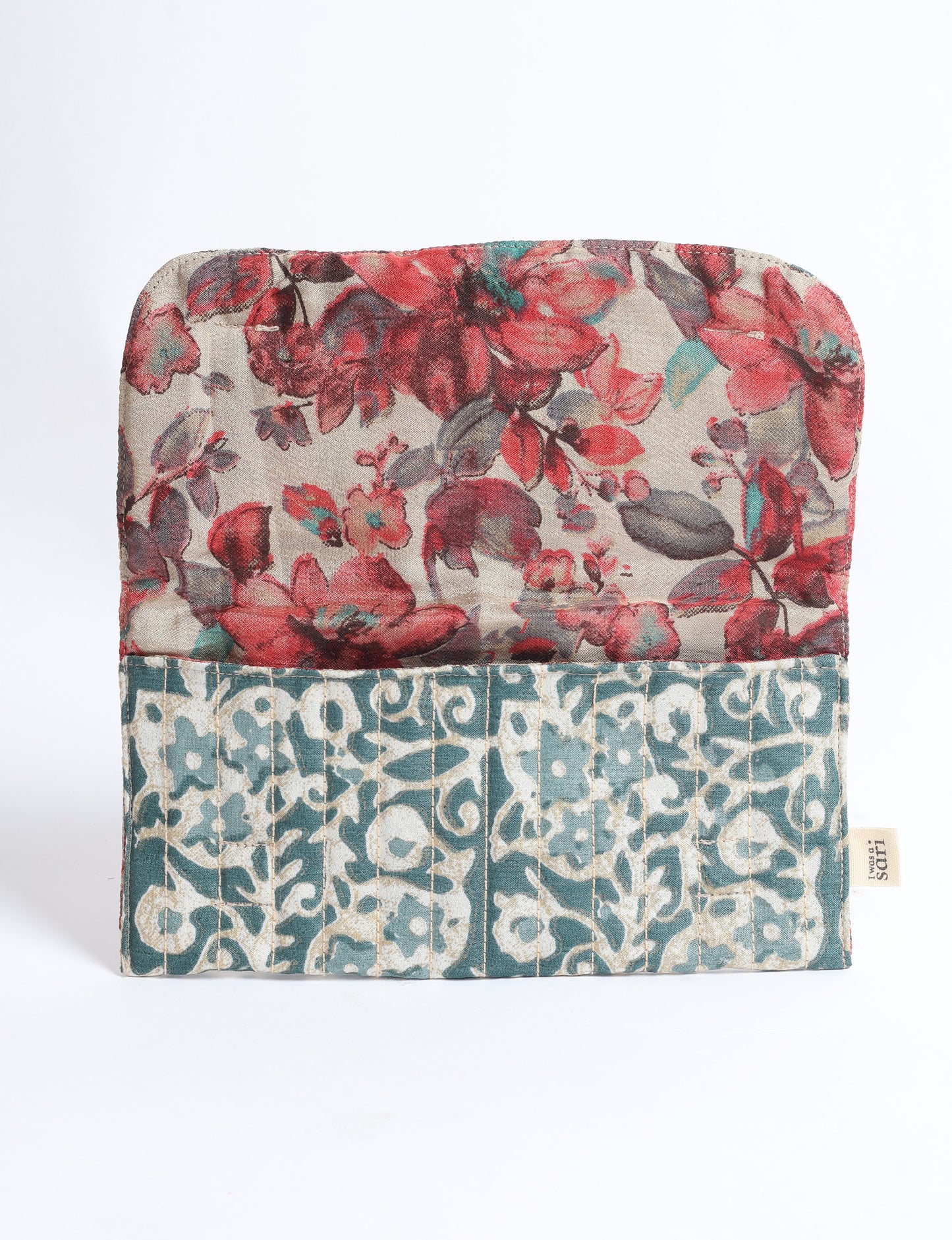 Quilted sunglasses case made from recycled sari products, featuring a secure magnetic closure. A chic example of ethical fashion, conscious clothing, and carbon neutral fashion. Protect your sunglasses while embracing circular fashion and upcycled garments.