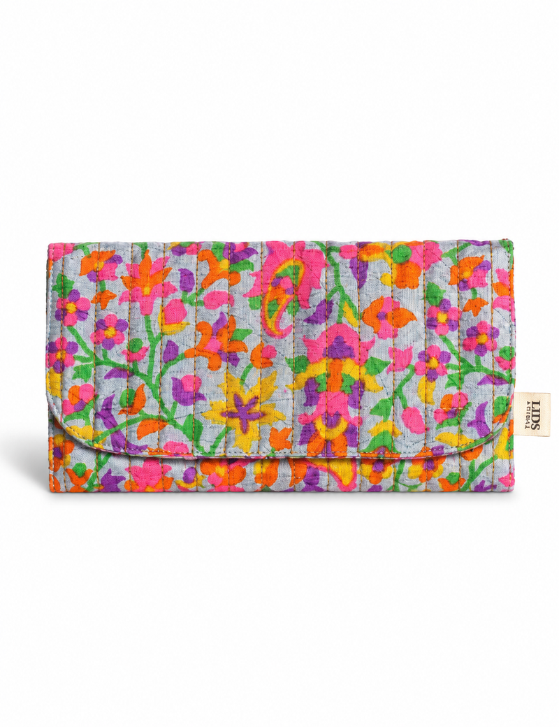 Quilted sunglasses case made from recycled sari products, featuring a secure magnetic closure. A chic example of ethical fashion, conscious clothing, and carbon neutral fashion. Protect your sunglasses while embracing circular fashion and upcycled garments.