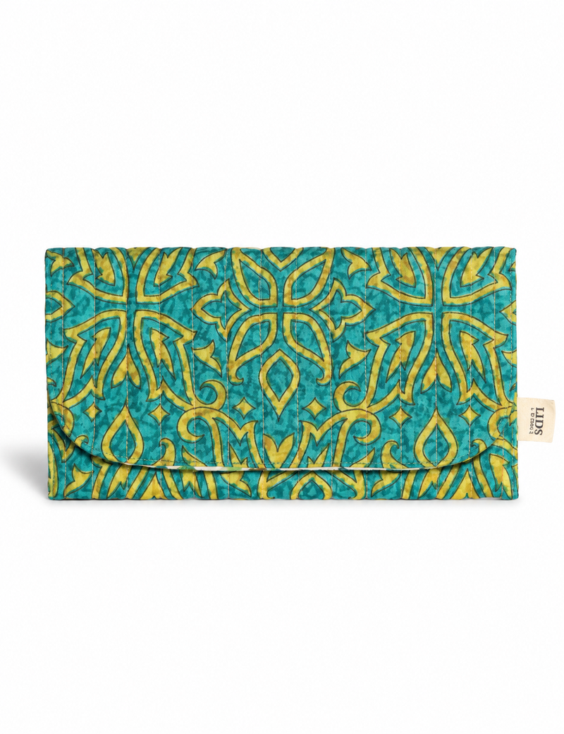 Quilted sunglasses case made from recycled sari products, featuring a secure magnetic closure. A chic example of ethical fashion, conscious clothing, and carbon neutral fashion. Protect your sunglasses while embracing circular fashion and upcycled garments.