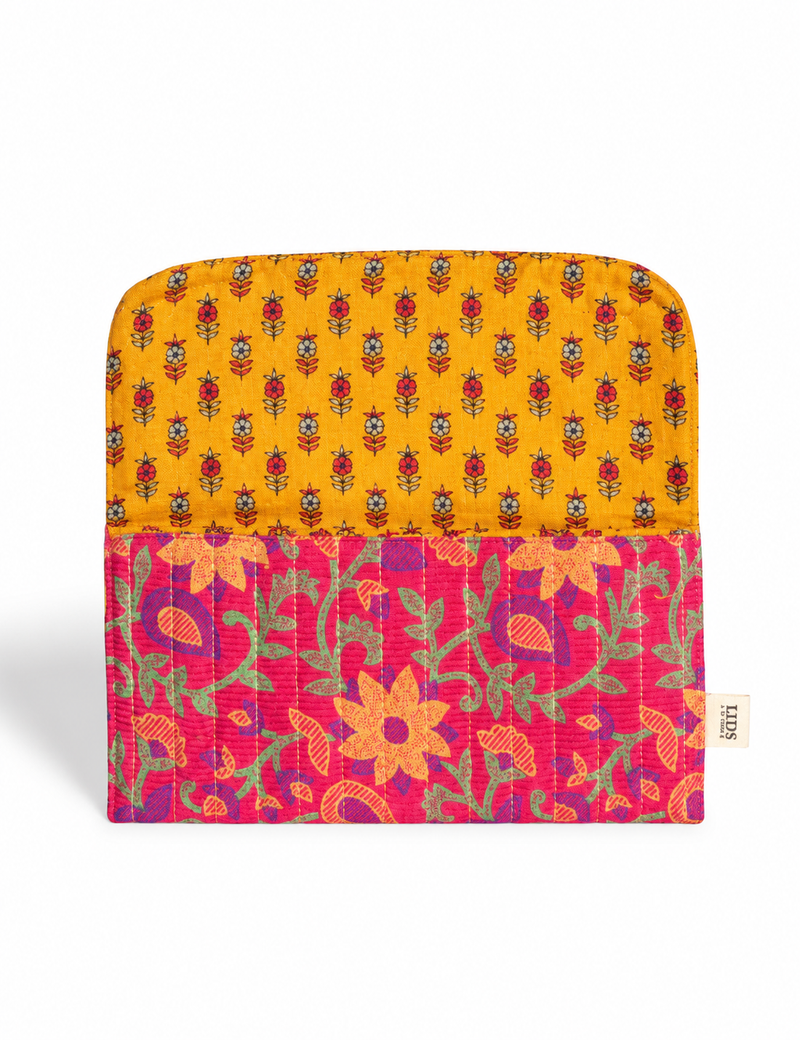 Quilted sunglasses case made from recycled sari products, featuring a secure magnetic closure. A chic example of ethical fashion, conscious clothing, and carbon neutral fashion. Protect your sunglasses while embracing circular fashion and upcycled garments.