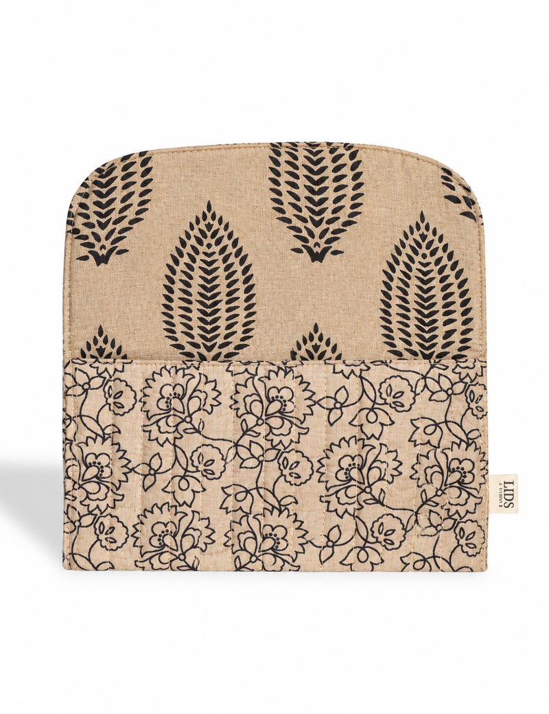 Quilted sunglasses case made from recycled sari products, featuring a secure magnetic closure. A chic example of ethical fashion, conscious clothing, and carbon neutral fashion. Protect your sunglasses while embracing circular fashion and upcycled garments.