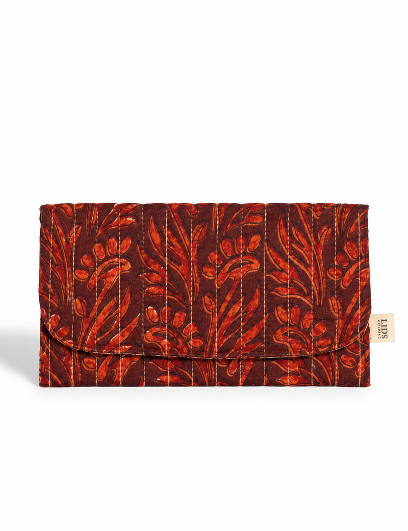 Quilted sunglasses case made from recycled sari products, featuring a secure magnetic closure. A chic example of ethical fashion, conscious clothing, and carbon neutral fashion. Protect your sunglasses while embracing circular fashion and upcycled garments.