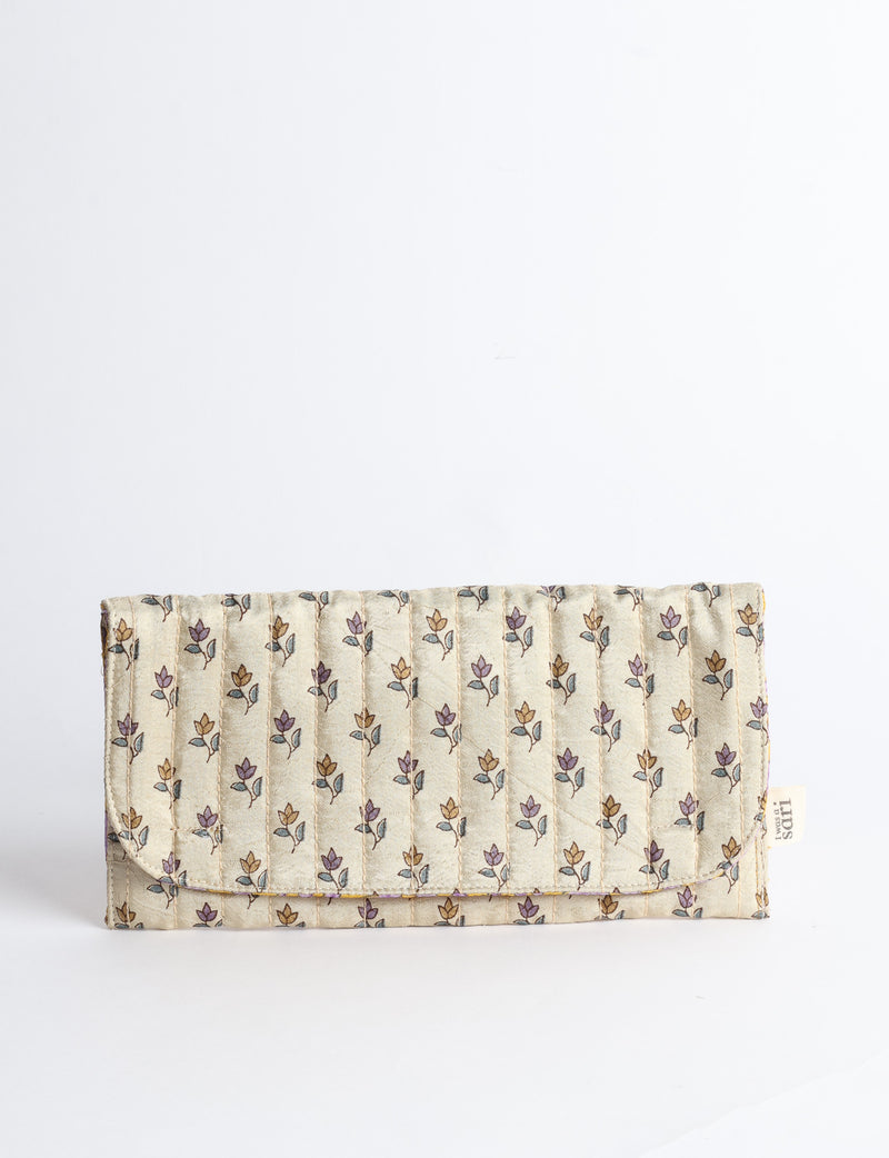 Quilted sunglasses case made from recycled sari products, featuring a secure magnetic closure. A chic example of ethical fashion, conscious clothing, and carbon neutral fashion. Protect your sunglasses while embracing circular fashion and upcycled garments.