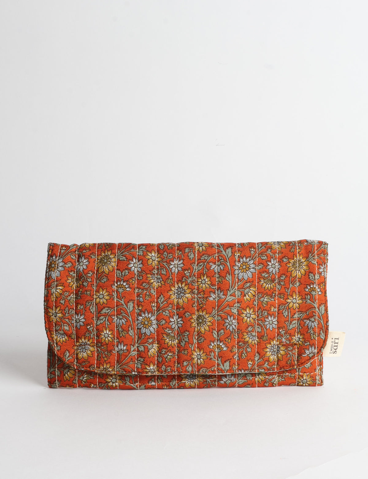 Quilted sunglasses case made from recycled sari products, featuring a secure magnetic closure. A chic example of ethical fashion, conscious clothing, and carbon neutral fashion. Protect your sunglasses while embracing circular fashion and upcycled garments.