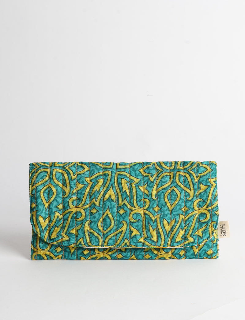 Quilted sunglasses case made from recycled sari products, featuring a secure magnetic closure. A chic example of ethical fashion, conscious clothing, and carbon neutral fashion. Protect your sunglasses while embracing circular fashion and upcycled garments.