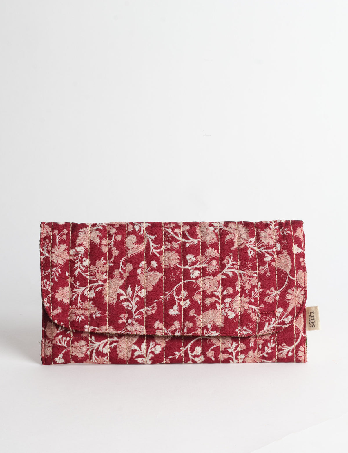 Quilted sunglasses case made from recycled sari products, featuring a secure magnetic closure. A chic example of ethical fashion, conscious clothing, and carbon neutral fashion. Protect your sunglasses while embracing circular fashion and upcycled garments.