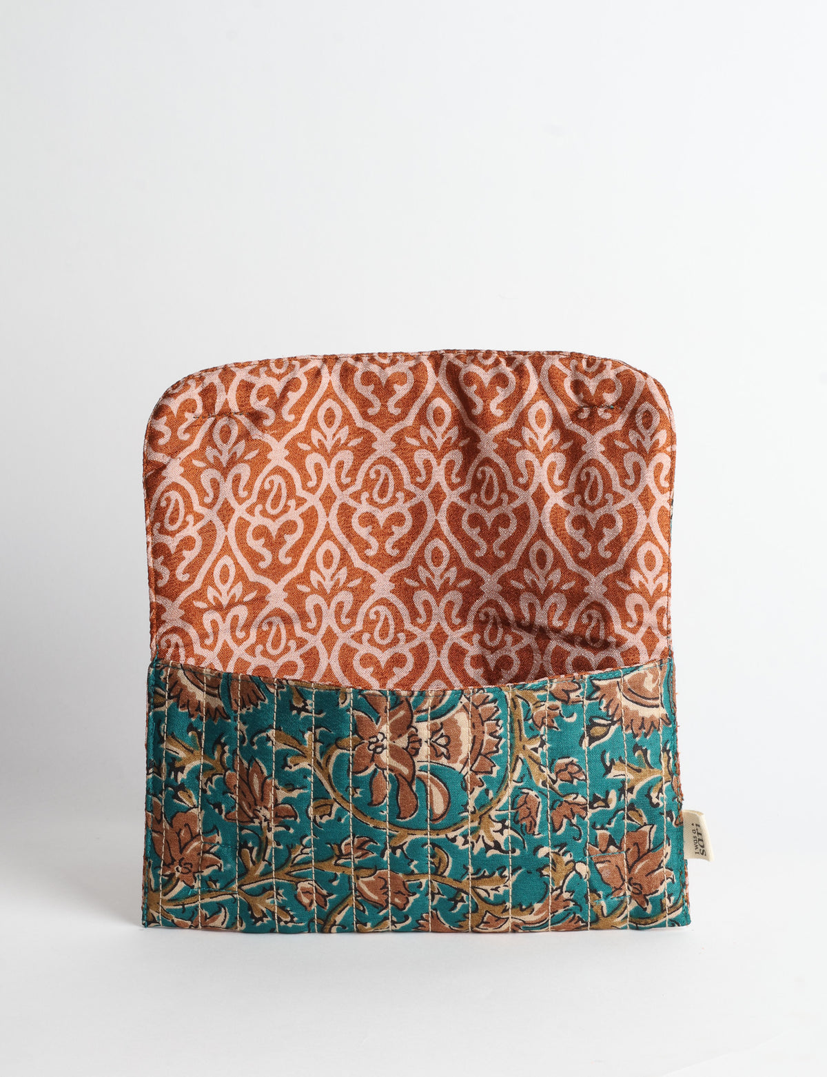 Quilted sunglasses case made from recycled sari products, featuring a secure magnetic closure. A chic example of ethical fashion, conscious clothing, and carbon neutral fashion. Protect your sunglasses while embracing circular fashion and upcycled garments.
