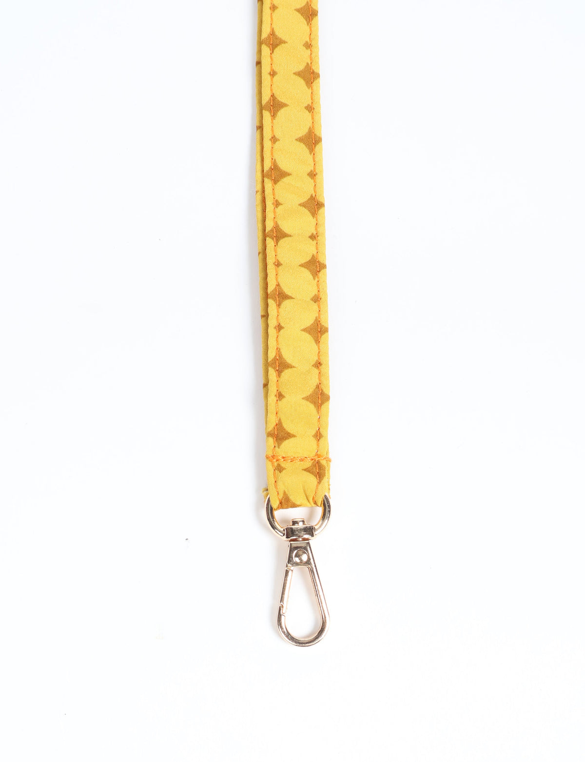 Yellow fabric keychain lanyard with brown geometric pattern and silver metal clasp, shown flat on white background