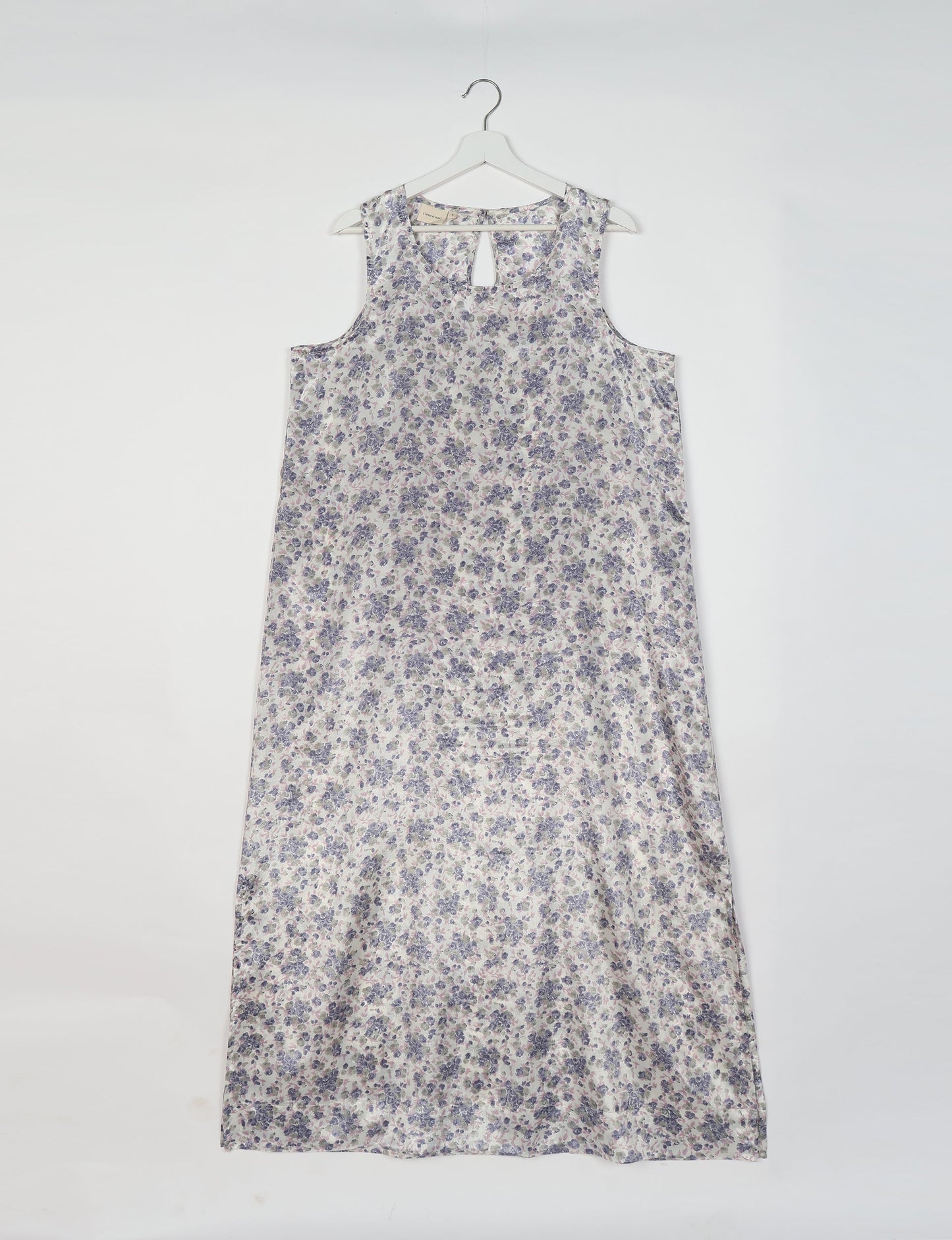 Sleeveless A-Line maxi dress made from recycled saris, showcasing eco clothing and green fashion. A chic example of upcycled women's clothing and climate neutral clothing, perfect for fans of circular fashion, carbon neutral fashion, and products made from textile waste.