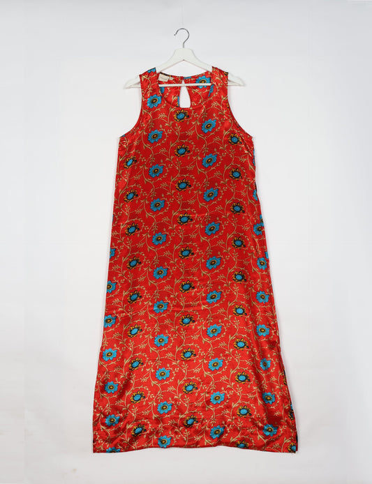 Sleeveless A-Line maxi dress made from recycled saris, showcasing eco clothing and green fashion. A chic example of upcycled women's clothing and climate neutral clothing, perfect for fans of circular fashion, carbon neutral fashion, and products made from textile waste.