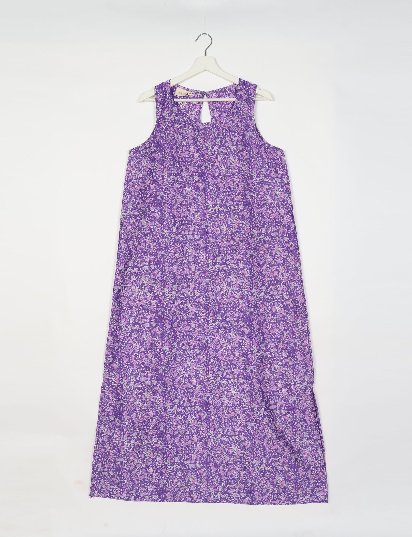 Sleeveless A-Line maxi dress made from recycled saris, showcasing eco clothing and green fashion. A chic example of upcycled women's clothing and climate neutral clothing, perfect for fans of circular fashion, carbon neutral fashion, and products made from textile waste.