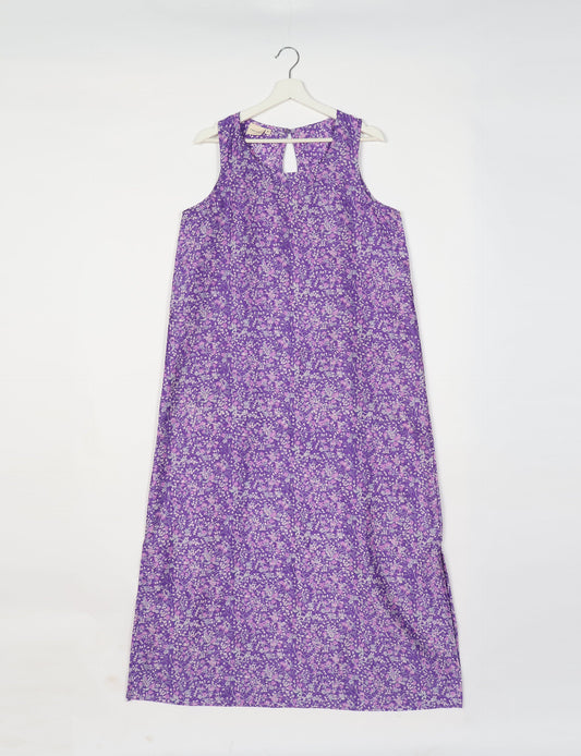 Sleeveless A-Line maxi dress made from recycled saris, showcasing eco clothing and green fashion. A chic example of upcycled women's clothing and climate neutral clothing, perfect for fans of circular fashion, carbon neutral fashion, and products made from textile waste.