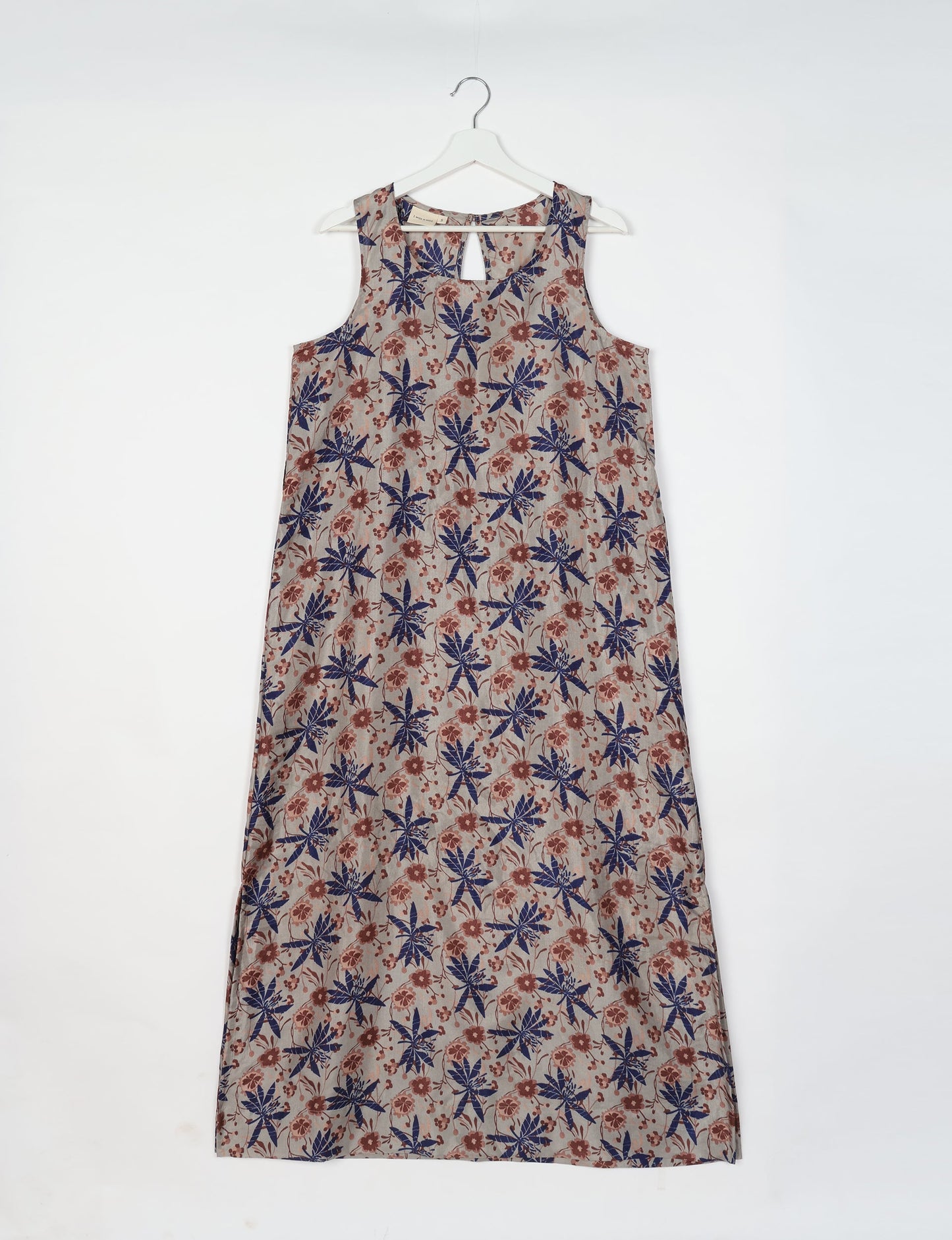 Sleeveless A-Line maxi dress made from recycled saris, showcasing eco clothing and green fashion. A chic example of upcycled women's clothing and climate neutral clothing, perfect for fans of circular fashion, carbon neutral fashion, and products made from textile waste.