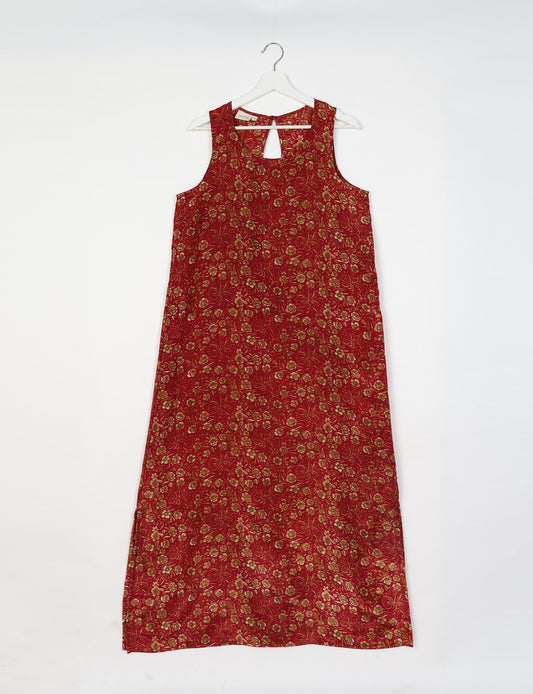 Sleeveless A-Line maxi dress made from recycled saris, showcasing eco clothing and green fashion. A chic example of upcycled women's clothing and climate neutral clothing, perfect for fans of circular fashion, carbon neutral fashion, and products made from textile waste.
