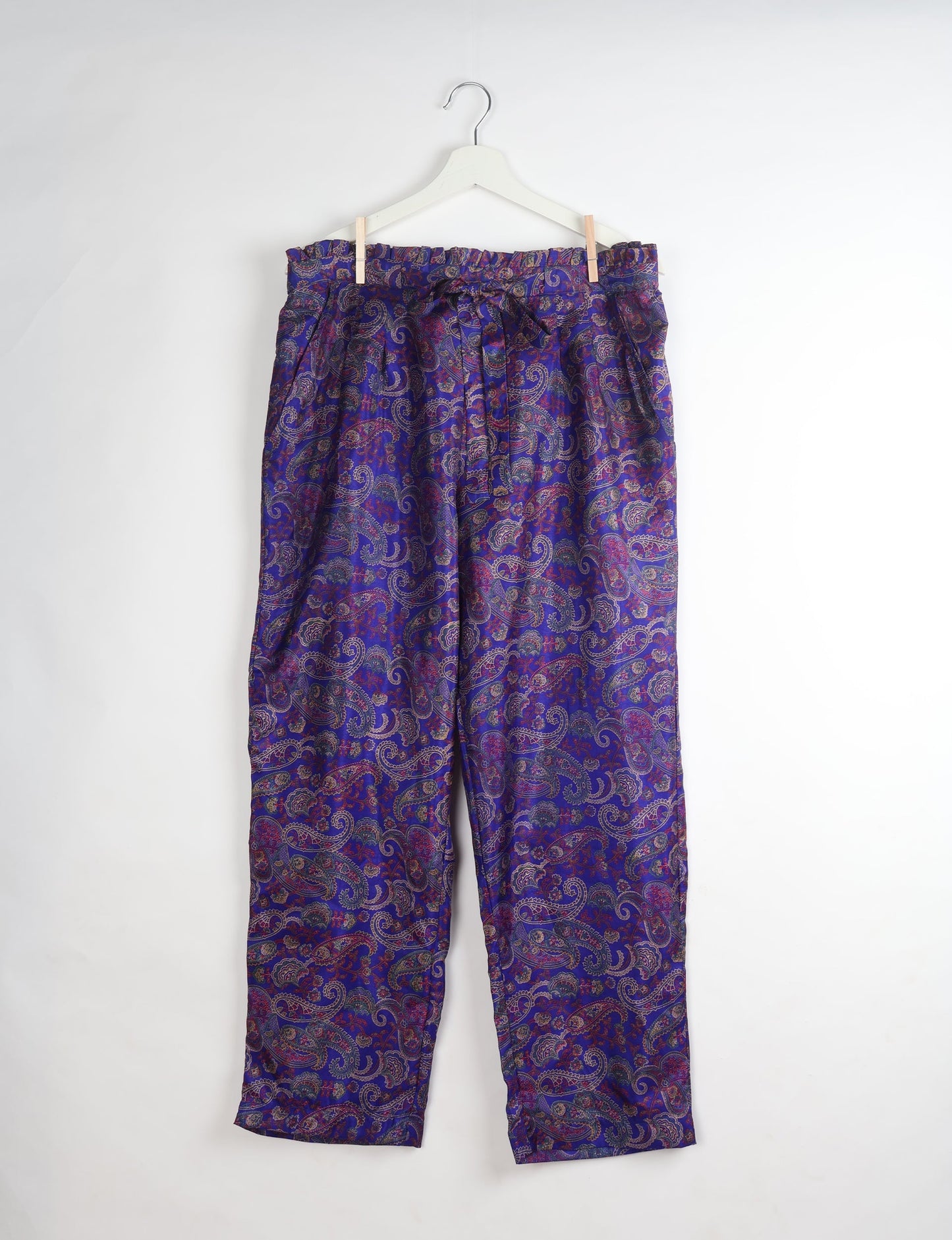 Paperbag high waisted pull-on pants for women made from upcycled garments and recycled fabric, featuring eco clothing design with an elasticated waistband and side pockets. A beautiful example of sustainable women’s clothing and environmentally friendly clothing inspired by upcycling fashion and green fashion movements.