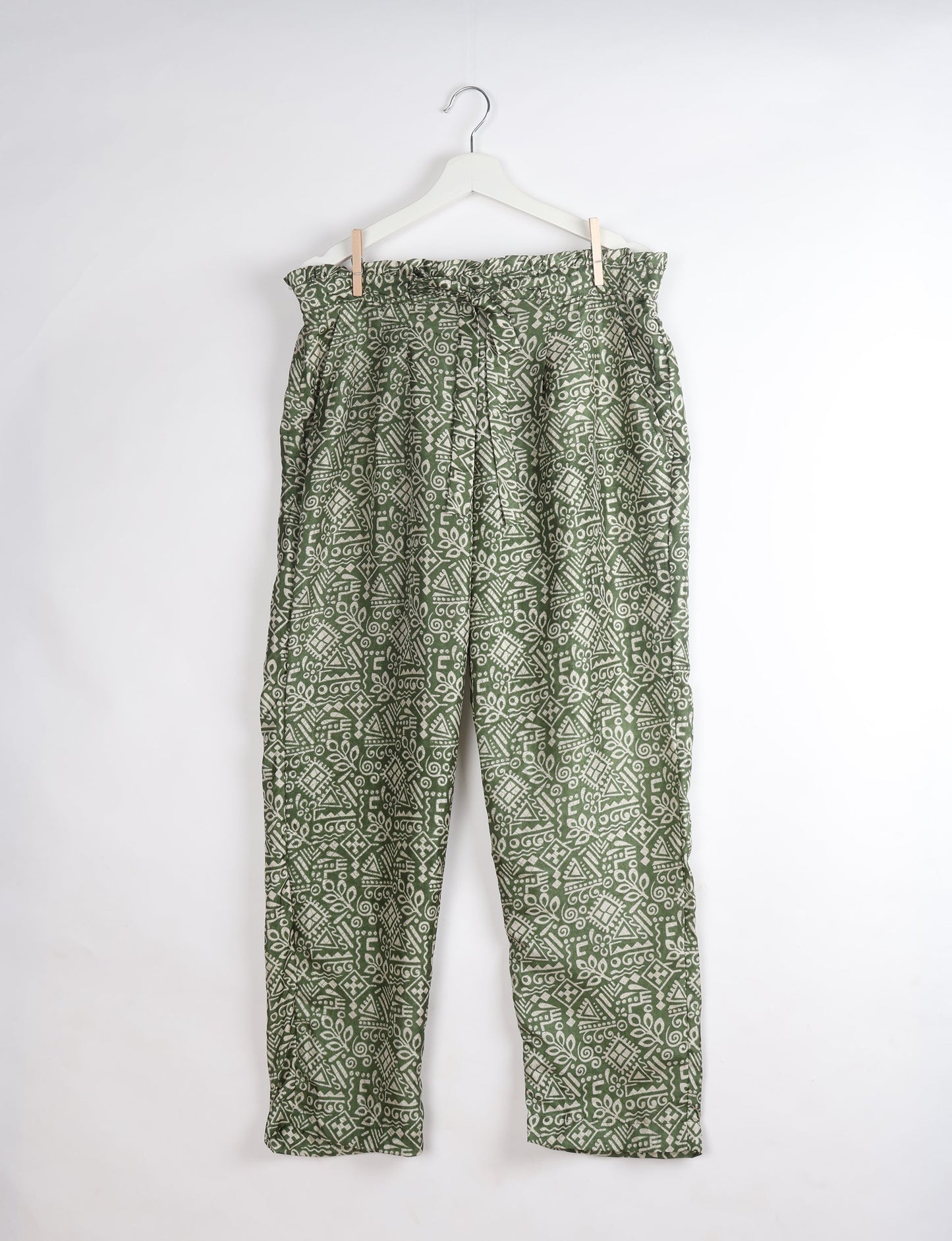 Paperbag high waisted pull-on pants for women made from upcycled garments and recycled fabric, featuring eco clothing design with an elasticated waistband and side pockets. A beautiful example of sustainable women’s clothing and environmentally friendly clothing inspired by upcycling fashion and green fashion movements.