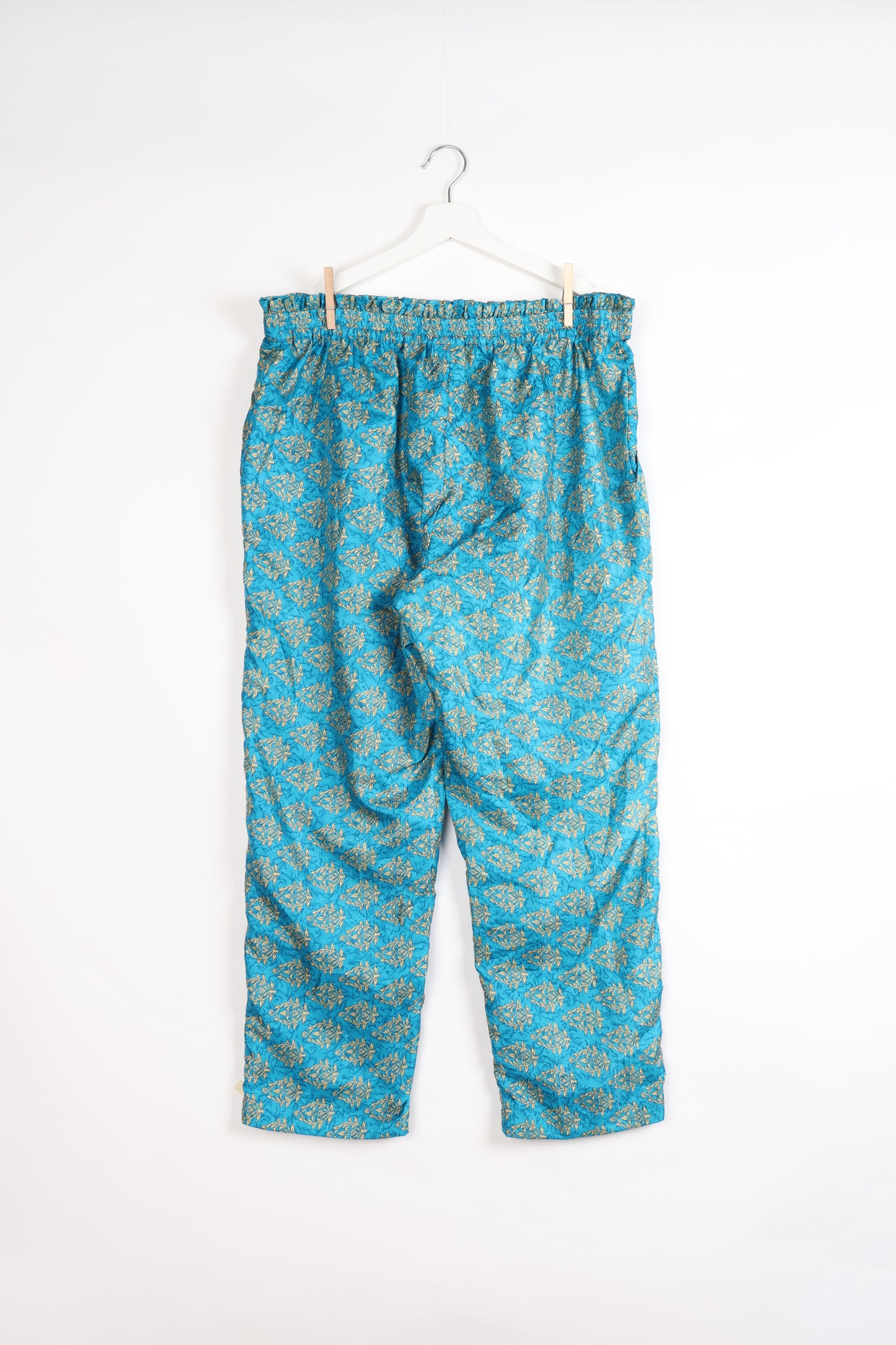 Paperbag high waisted pull-on pants for women made from upcycled garments and recycled fabric, featuring eco clothing design with an elasticated waistband and side pockets. A beautiful example of sustainable women’s clothing and environmentally friendly clothing inspired by upcycling fashion and green fashion movements.