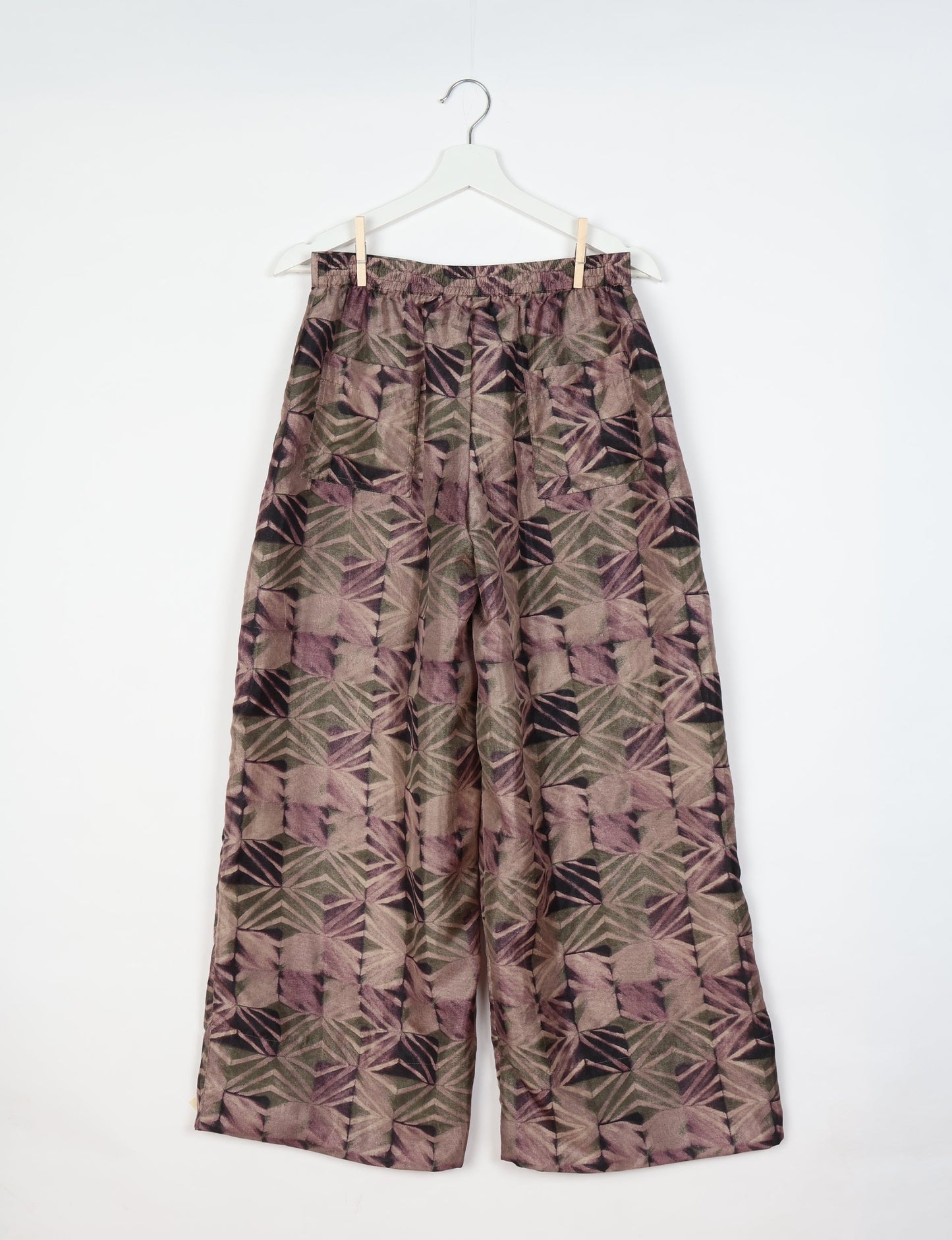 Upcycled women’s wide leg pants made from preloved saris, showcasing eco friendly clothes, zero waste clothing, and carbon neutral fashion.