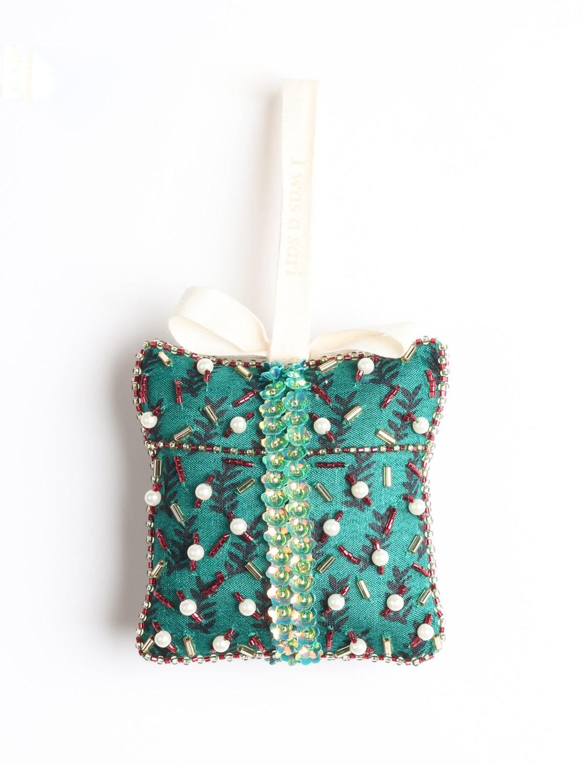 Red fabric gift ornament decorated with multicolored beads and pearls, with a green fabric hanging loop and ribbon