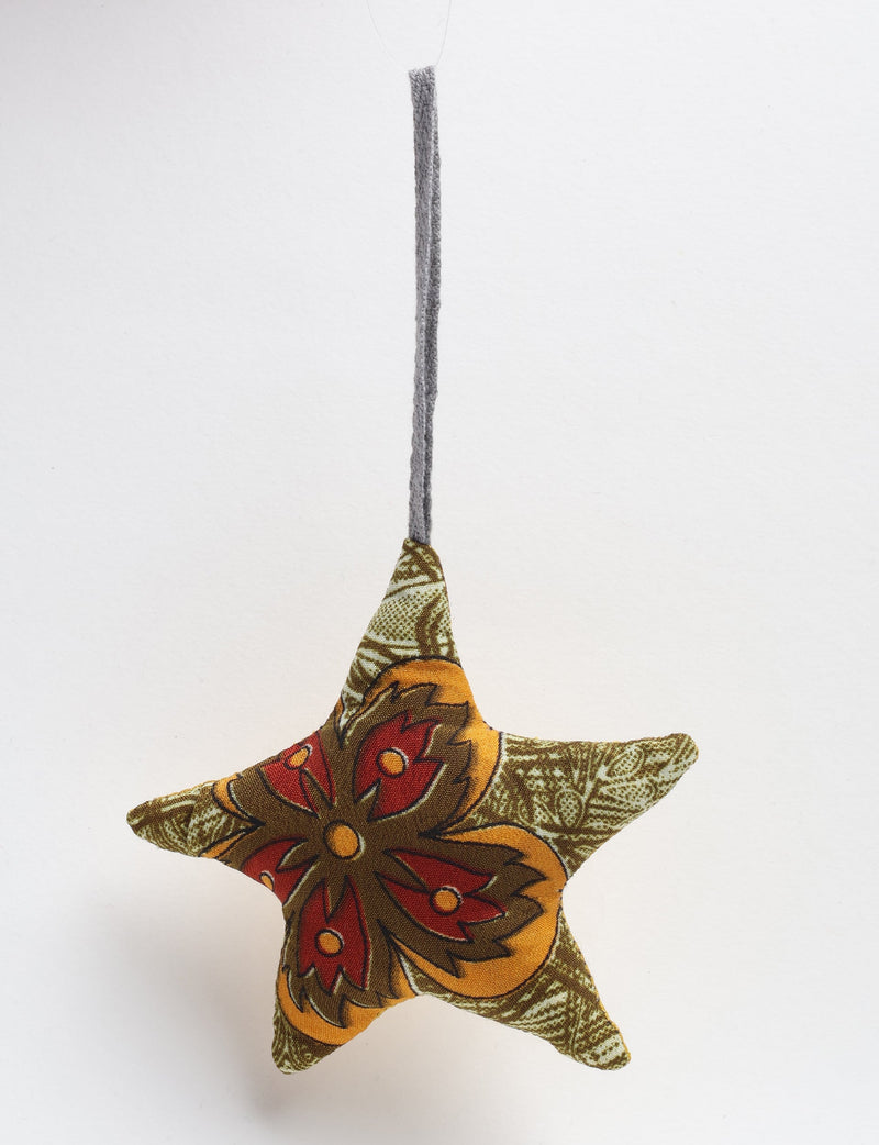 Mini star-shaped fabric bauble with red and orange floral pattern and green leafy background, hanging by gray loop