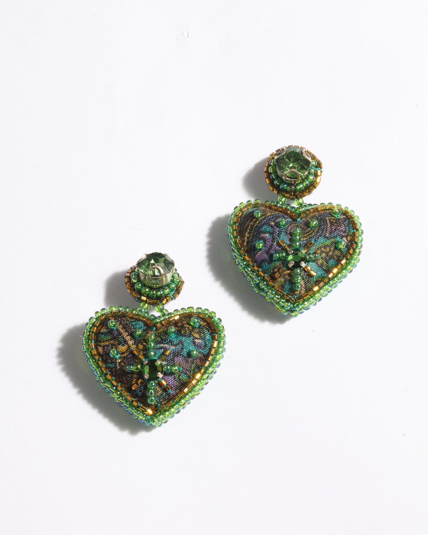 Hand-embroidered Heart Drop Earrings featuring intricate Aari stitching, crafted from recycled sari fabric. A stunning blend of upcycled clothing, ethical fashion, and circular fashion, these earrings embrace recycled sustainable fashion and earth-friendly clothing for a truly elegant, eco-conscious choice.