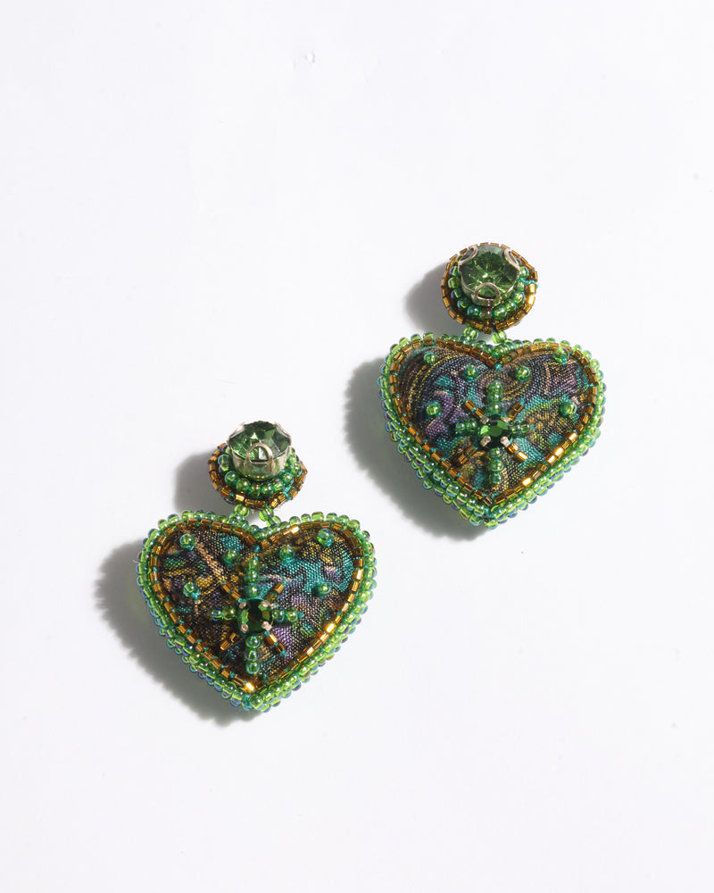 Heart drop earrings with green abstract fabric and green bead embellishments, shown flat on white background
