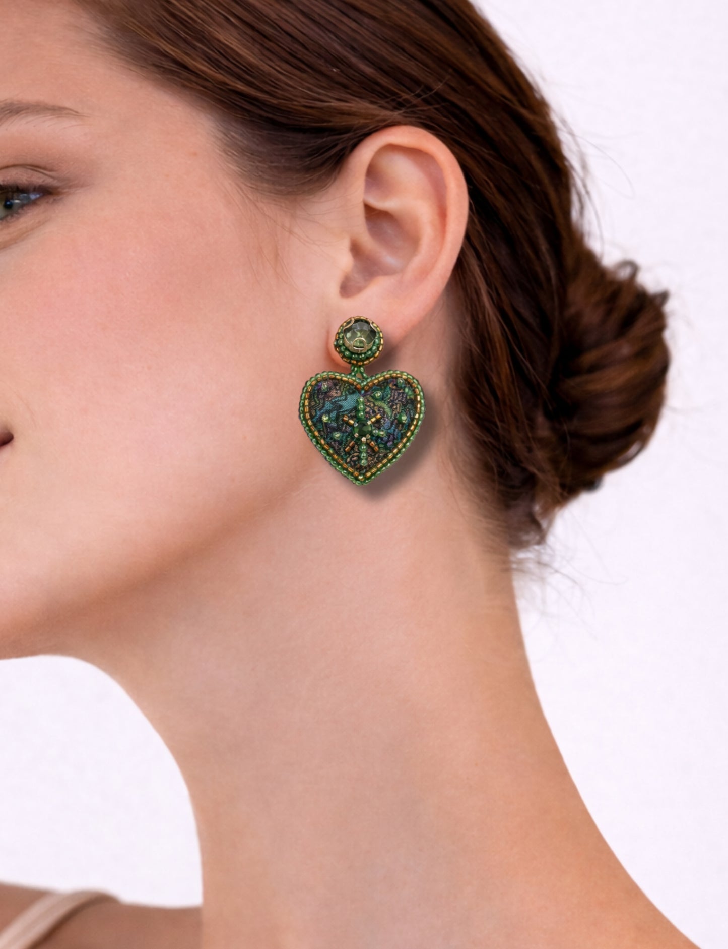 Hand-embroidered Heart Drop Earrings featuring intricate Aari stitching, crafted from recycled sari fabric. A stunning blend of upcycled clothing, ethical fashion, and circular fashion, these earrings embrace recycled sustainable fashion and earth-friendly clothing for a truly elegant, eco-conscious choice.