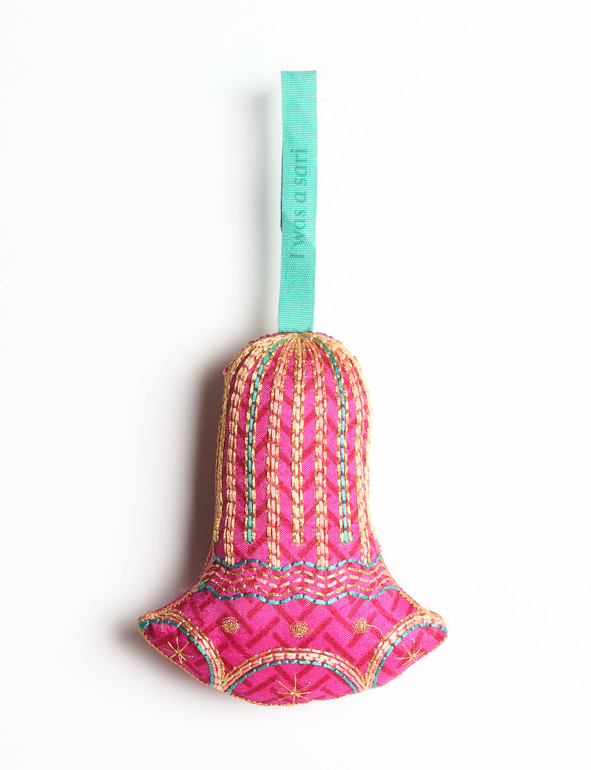 Red fabric bell ornament with gold and teal stitched details and a teal hanging loop with faint text visible