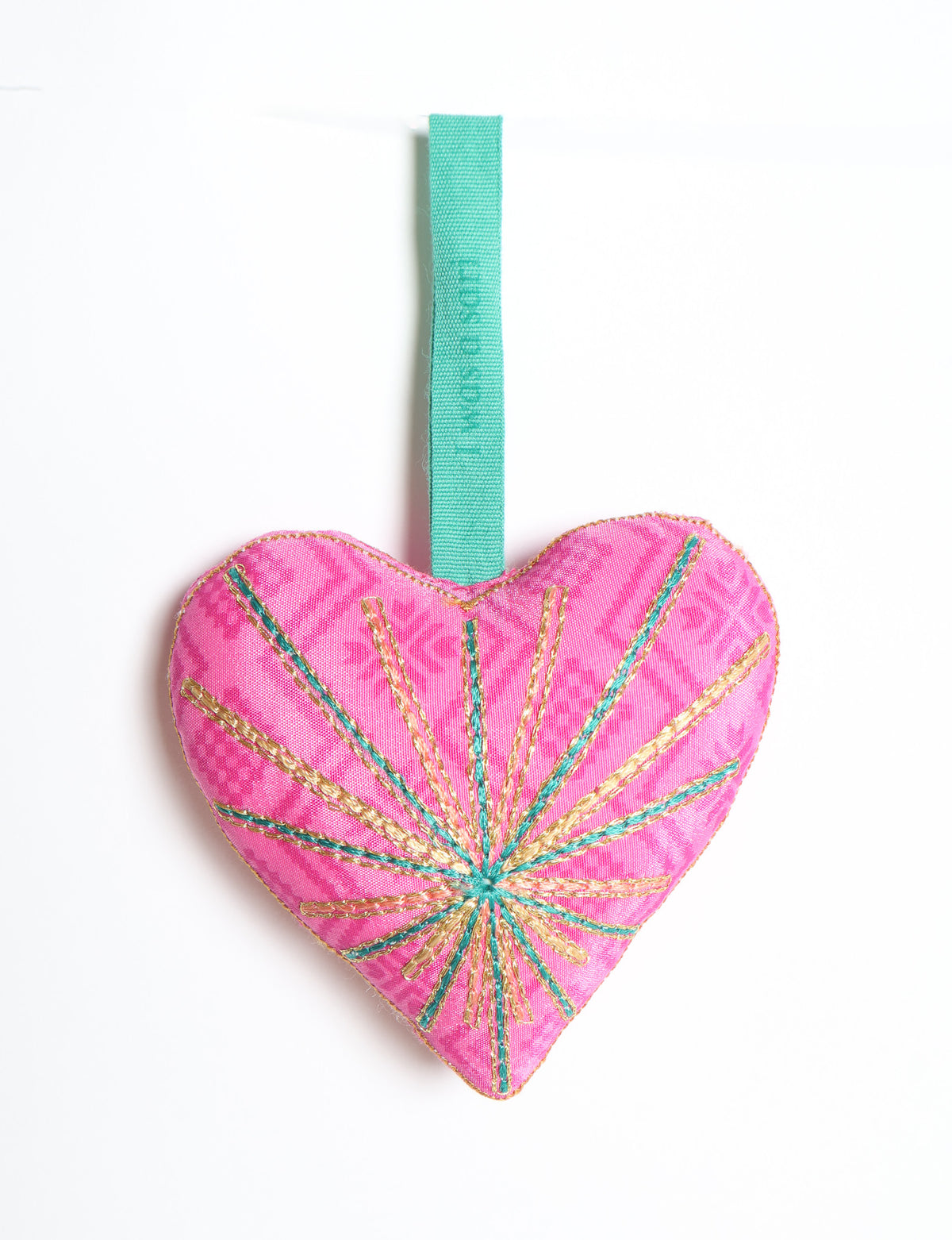Timeless Heart ornament made from upcycled clothing and recycled fabric, filled with organic cotton and hand-finished with vibrant silk and metallic thread. An eco-friendly, carbon neutral fashion piece that supports green fashion and fair trade apparel.