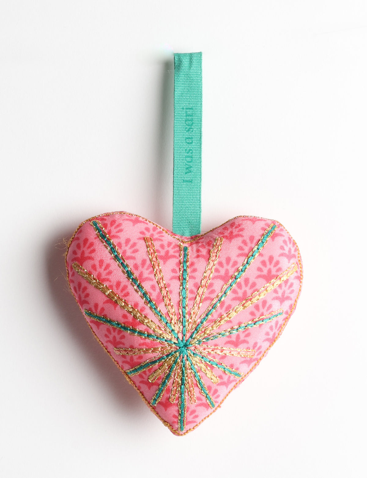 Timeless Heart ornament made from upcycled clothing and recycled fabric, filled with organic cotton and hand-finished with vibrant silk and metallic thread. An eco-friendly, carbon neutral fashion piece that supports green fashion and fair trade apparel.