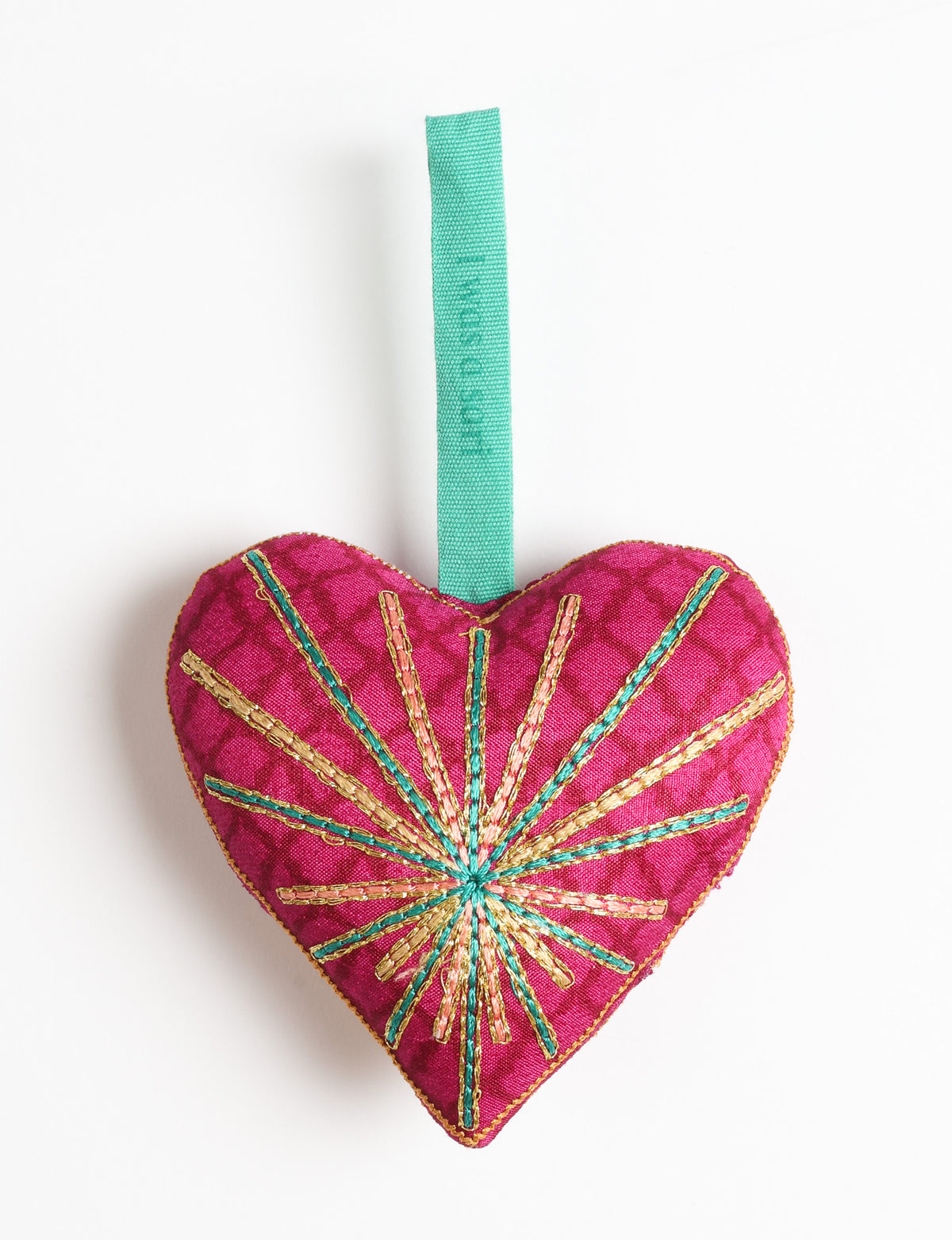 Timeless Heart ornament made from upcycled clothing and recycled fabric, filled with organic cotton and hand-finished with vibrant silk and metallic thread. An eco-friendly, carbon neutral fashion piece that supports green fashion and fair trade apparel.