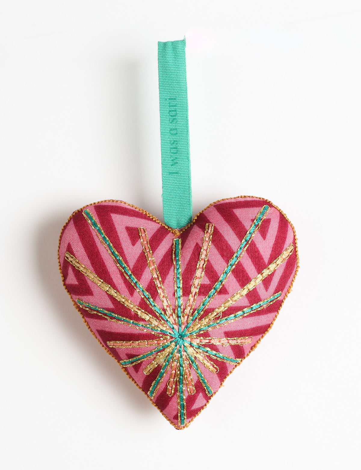 Timeless Heart ornament made from upcycled clothing and recycled fabric, filled with organic cotton and hand-finished with vibrant silk and metallic thread. An eco-friendly, carbon neutral fashion piece that supports green fashion and fair trade apparel.