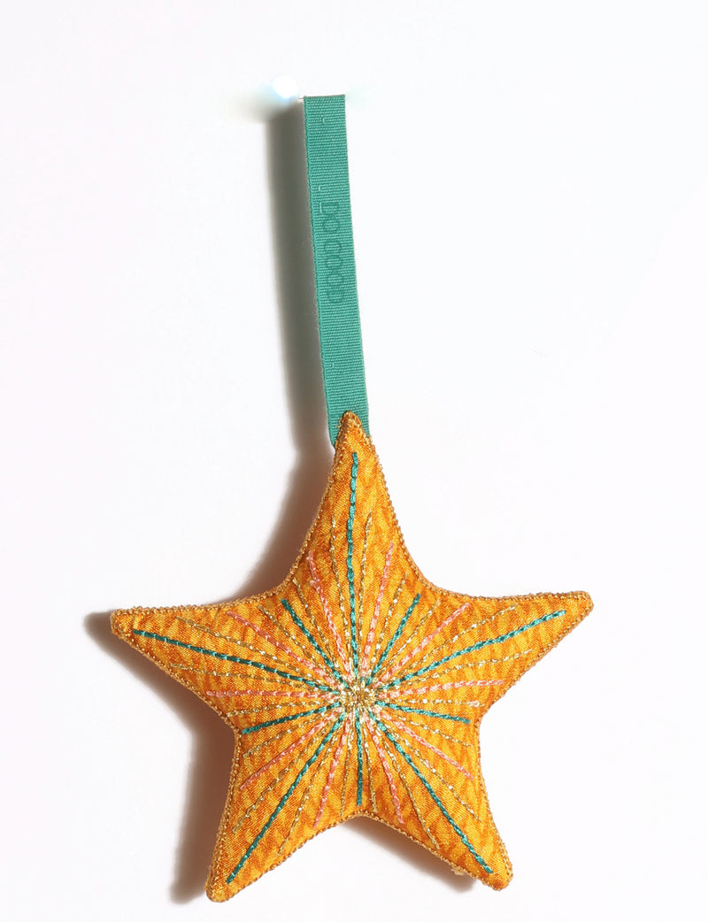 Handmade star ornament made from preloved saris with vibrant silk and gold thread embroidery and DO GOOD detailing.